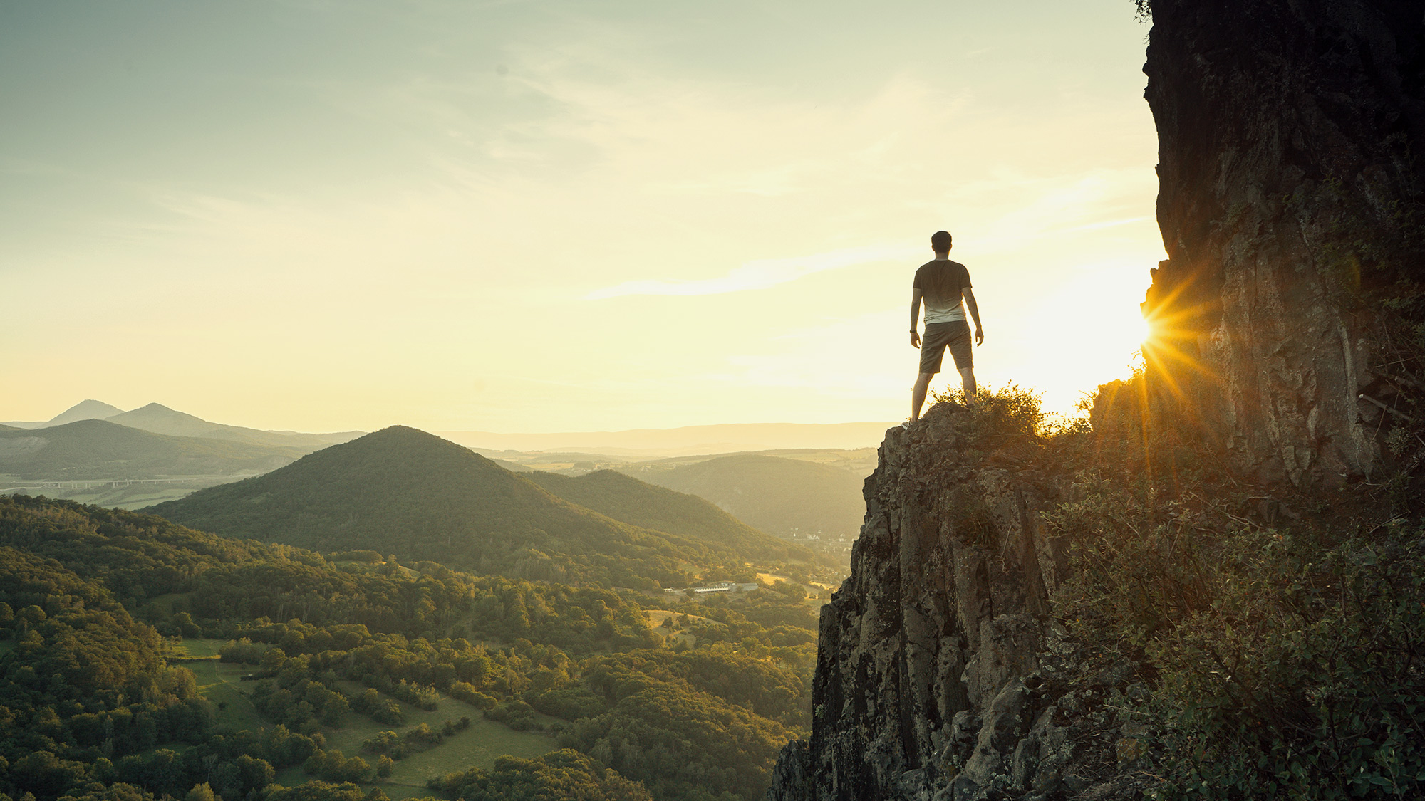 explorer standing on mountain