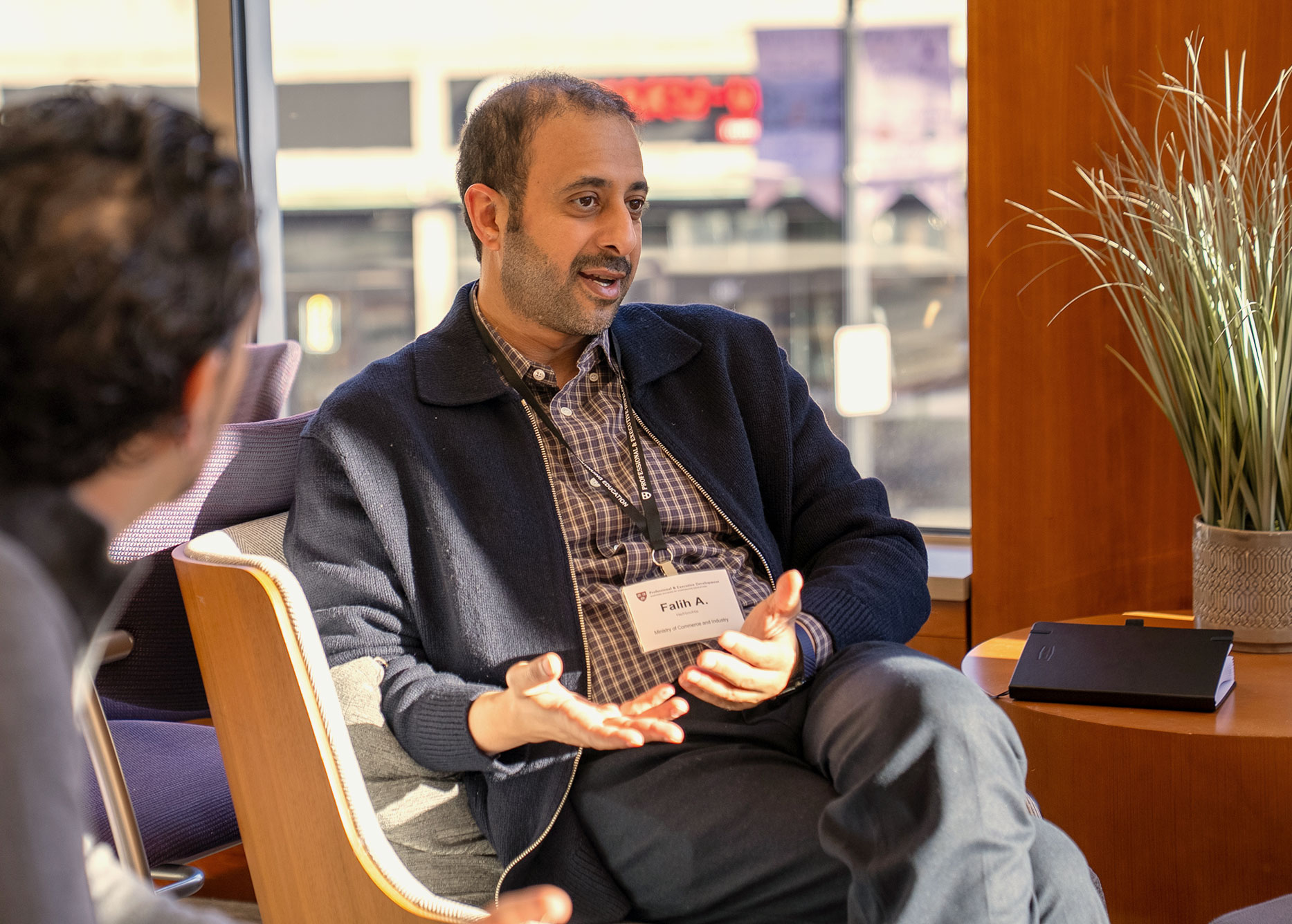 Two Harvard Professional & Executive Development Program participants talk during class.