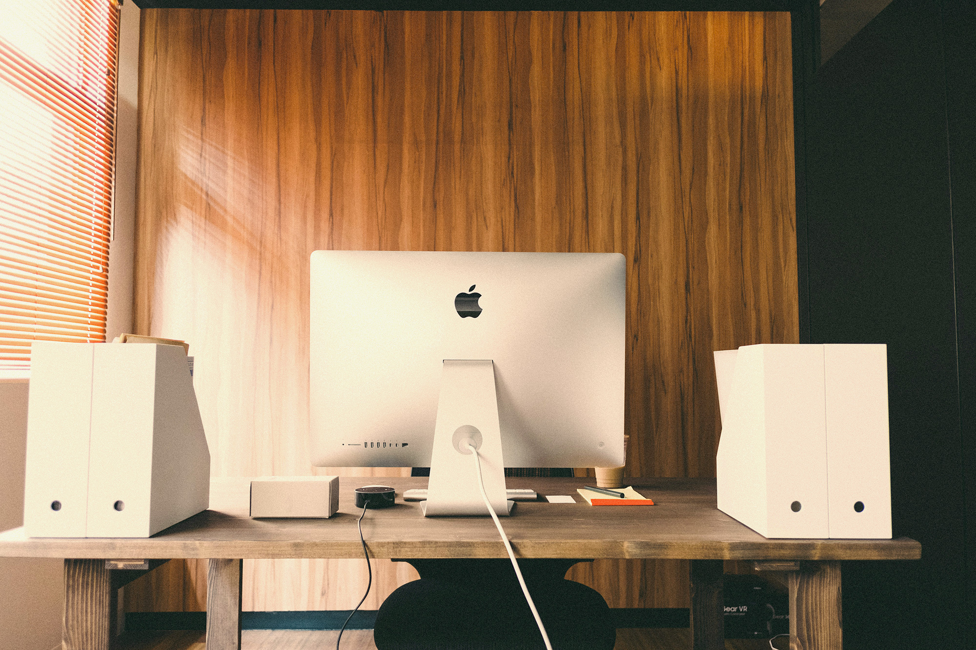 Apple computer on a desk.