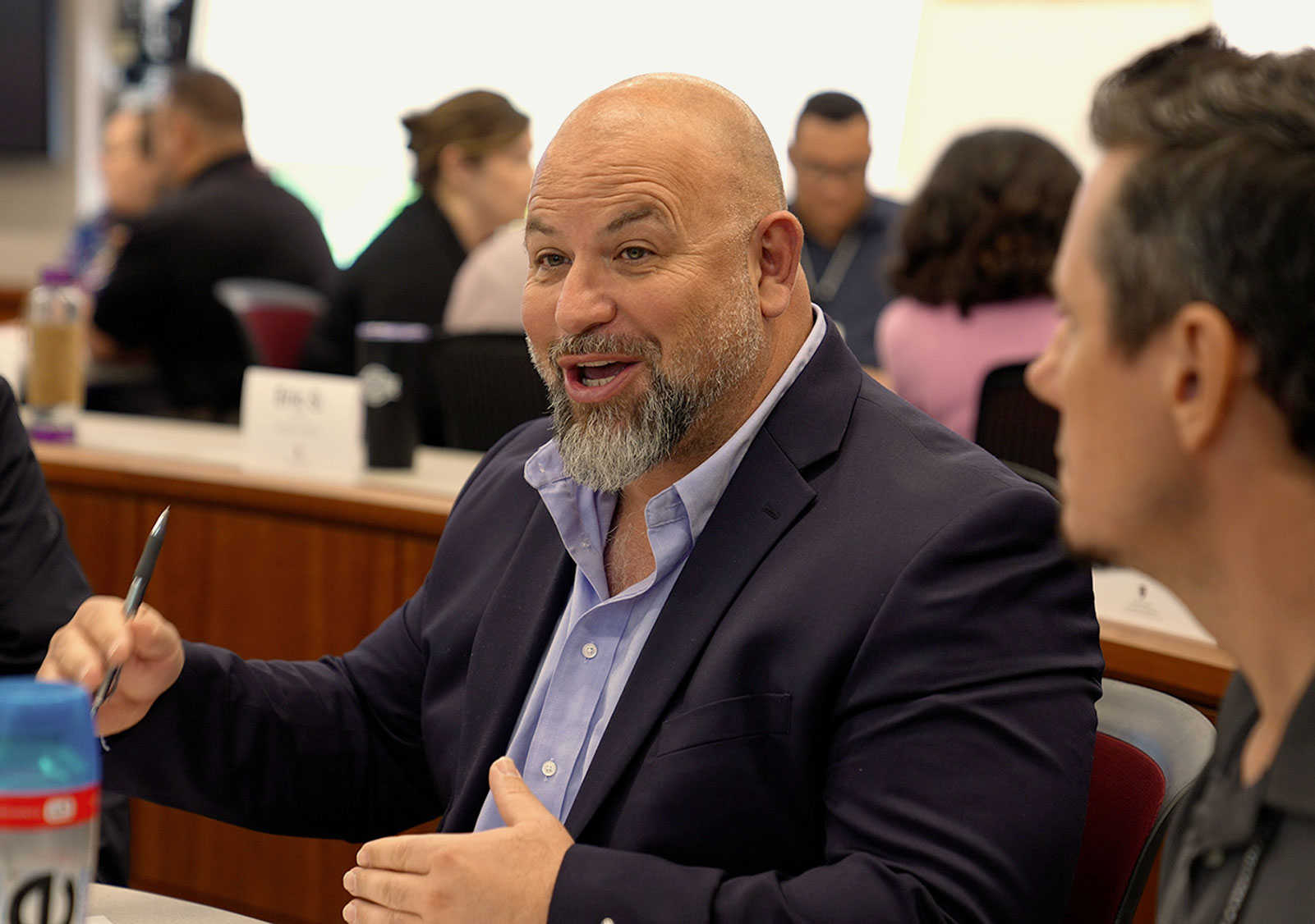 A Harvard Professional & Executive Development program participant talks during class.