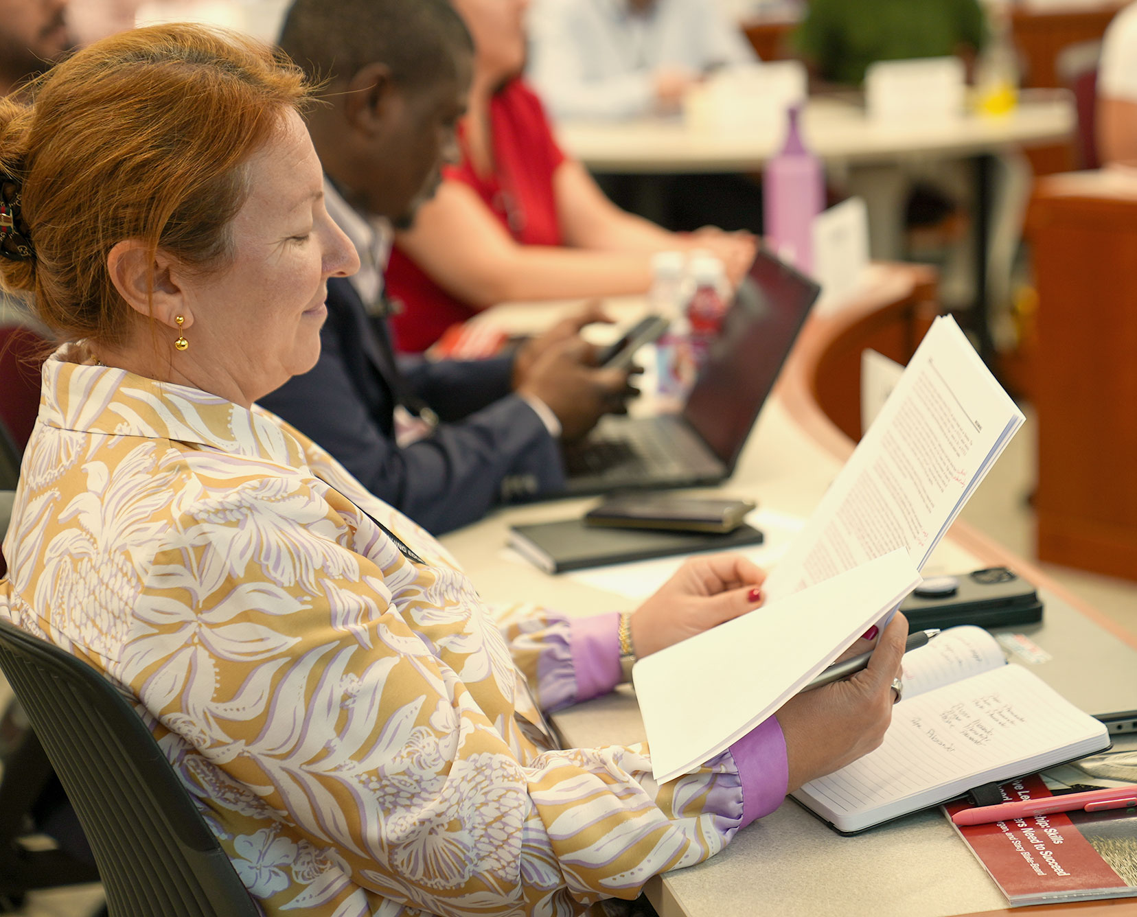 A Harvard Professional & Executive Development program participant sits in class.